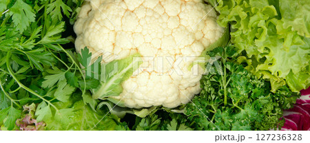Beautiful bright natural background. Leaves of different sizes and colors close-up. Greens for making salad, detox. assortment of fresh, green leafy vegetables Beautiful bright natural background. Leaves of different sizes and colors close-up. Greens for making salad, detox. assortment of fresh, green leafy vegetables 127236328