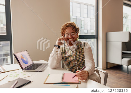 A Creative Professional Engaged in Dynamic Activities in a Modern Office Environment A Creative Professional Engaged in Dynamic Activities in a Modern Office Environment 127238386