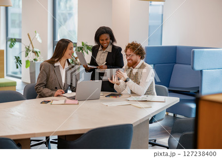 Engaging in a Collaborative Business Meeting within a WellDesigned Modern Office Space 127238400