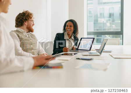 A Collaborative Business Meeting Held in a Modern Office Environment with Professionals 127238463