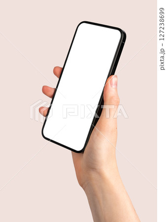 Woman holding smartphone, displaying a blank screen. Using mobile device for communication, browsing Woman holding smartphone, displaying a blank screen. Using mobile device for communication, browsing 127238699
