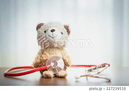 Teddy Bear with Stethoscope, Symbolizing Warmth, Healthcare, and Compassionate Care for Children Teddy Bear with Stethoscope, Symbolizing Warmth, Healthcare, and Compassionate Care for Children 127239510
