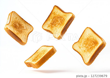 Floating toast. Two toast bread. Freshly Toasted Bread Slices Flying on a White Background. Bread Slices Pattern, Fresh Baked Loaf Texture. Contemporary food still-life. Fried croutons with crumbs 127239679