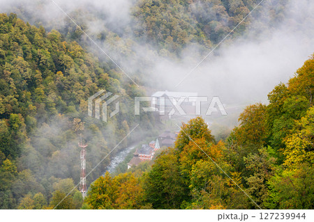 Rosa Khutor village aerial panoramic view. Rosa Khutor is an alpine ski resort located near Krasnaya Polyana town in Sochi region, Russia, autumn Rosa Khutor village aerial panoramic view. Rosa Khutor is an alpine ski resort located near Krasnaya Polyana town in Sochi region, Russia, autumn 127239944
