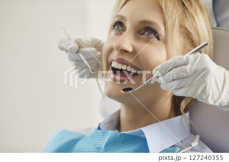 Woman Patient At Dentist For Oral Checkup In Clinic 127240355