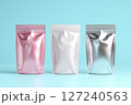 3D rendering of three pink, white, and rose gold mylar stand-up pouches with no graphics or text on a light blue background 127240563