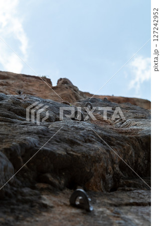 Rock Climbing Route with Bolts Leading to the Sky 127242952