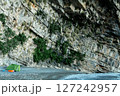 Wild Camping Beneath a Steep Rocky Cliff Face 127242957
