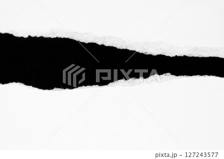 White ripped paper isolated on black background White ripped paper isolated on black background 127243577