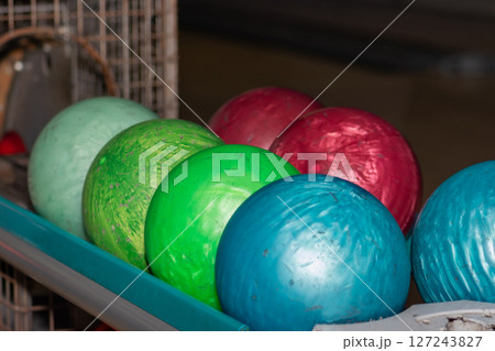 Very old colorful bowling balls background Very old colorful bowling balls background 127243827