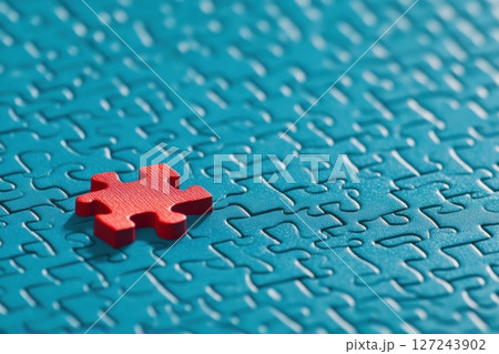 One piece detail of puzzle is red on blue puzzle background. Different concept. Puzzle pieces grid, Jigsaw blue colour. Success mosaic solution template. Symbol of business strategy, completing, team 127243902