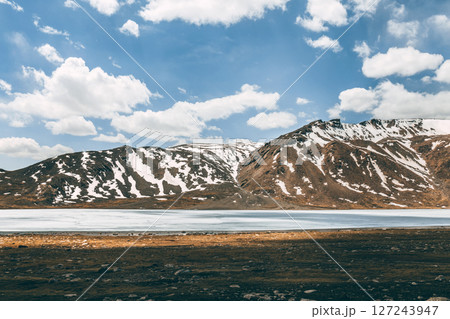 Frozen mountain lake. Arabel high plateau, Barskoon gorge, Kyrgyzstan 127243947