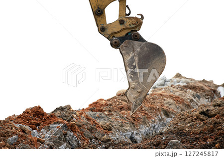 Mini excavator working in construction site isolated on white background Mini excavator working in construction site isolated on white background 127245817