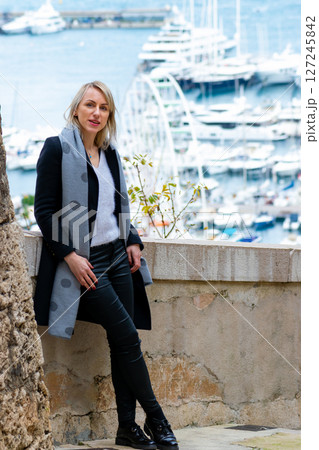 Woman portrait in front of the Monaco pier 127245842