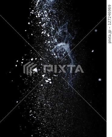 White Powder Explosion on Black Background 127246969