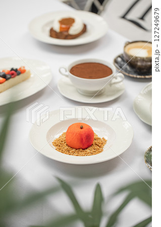 Assorted desserts on white restaurant table Assorted desserts on white restaurant table 127249679
