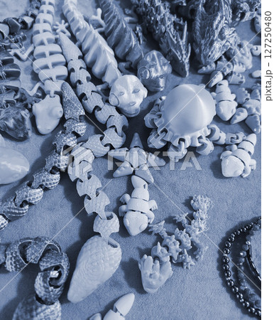 Art objects printed on a 3D printer. Various creative models created on a 3D printer from molten plastic. Concept 3D Printing. New modern 3D Printing additive technology. Blue color 127250480