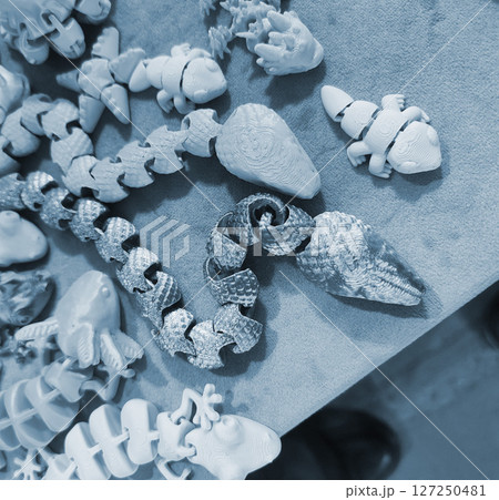 Art objects printed on a 3D printer. Various creative models created on a 3D printer from molten plastic. Concept 3D Printing. New modern 3D Printing additive technology. Blue color 127250481