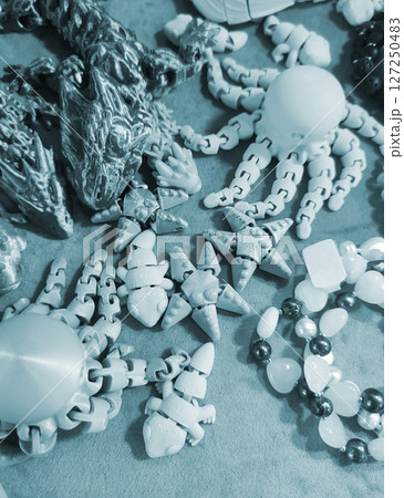 Art objects printed on a 3D printer. Various creative models created on a 3D printer from molten plastic. Concept 3D Printing. New modern 3D Printing additive technology. Blue color 127250483