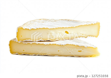 Fresh camembert cheese with sliced camembert isolated. Top view of camembert cheese piece on white background. Brie cheeses. Dairy products. Set of big round french cheeses with white mold. 127251038