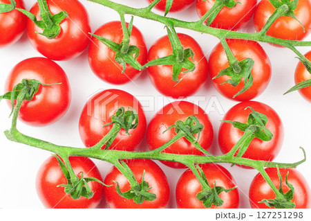 Branches of fresh cherry tomatoes isolated on white 127251298