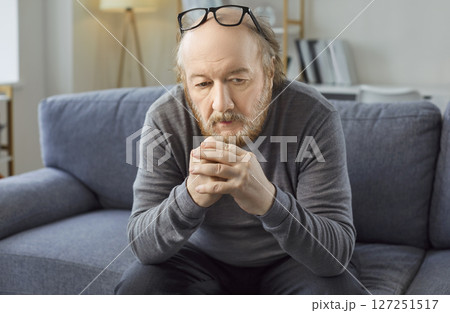 Sad thoughtful bored older man alone looking feeling depressed, frustrated, lonely, suffering  127251517