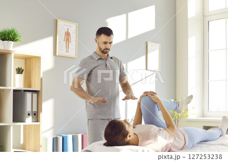 Rehabilitation Therapist Leg And Knee Joint Massage Rehabilitation Therapist Leg And Knee Joint Massage 127253238
