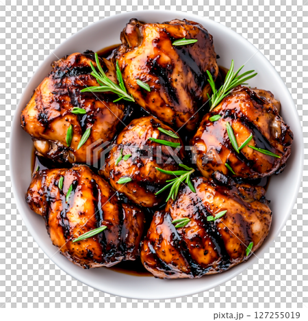 Grilled Chicken Thighs Glazed with Sweet Soy Sauce and Fresh Herbs on a White Plate 127255019