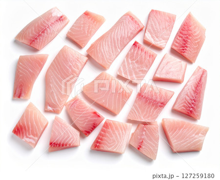 AI generated top view of fresh raw barramundi fish cut into premium fillets and chunks showcasing glistening texture and vibrant color on clean white space AI generated top view of fresh raw barramundi fish cut into premium fillets and chunks showcasing glistening texture and vibrant color on clean white space 127259180