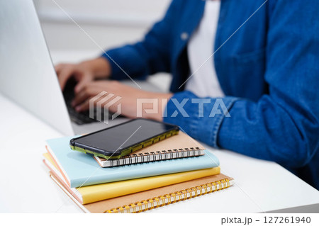 Teenage using tablet for communication, search data internet website to learn. 127261940