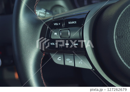 interior view of car with black leather, steering wheel with button interior view of car with black leather, steering wheel with button 127262679