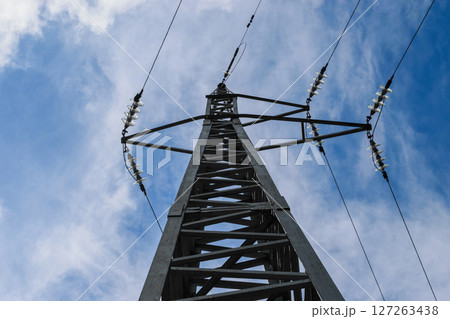 Metal electricity pole in blue sky with white clouds background 127263438