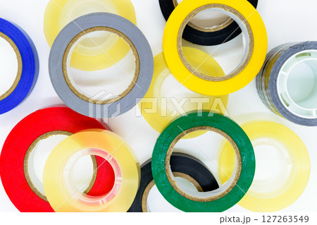 Various colors round adhesive tapes on white background surface Various colors round adhesive tapes on white background surface 127263549
