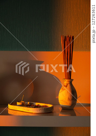 Burnt Incense Stick on a Tray and Vase with More Sticks for Aroma, Relaxation and Meditation at Home. Burnt Incense Stick on a Tray and Vase with More Sticks for Aroma, Relaxation and Meditation at Home. 127263611