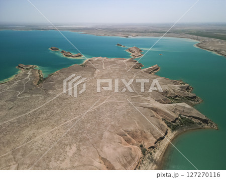 Aerial view of arid headland and intricate water shapes in reservoir Uzbekistan Aerial view of arid headland and intricate water shapes in reservoir Uzbekistan 127270116