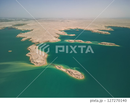 Aerial view of blue Kuimazar Reservoir and sandy islands in arid Uzbek landscape Aerial view of blue Kuimazar Reservoir and sandy islands in arid Uzbek landscape 127270140