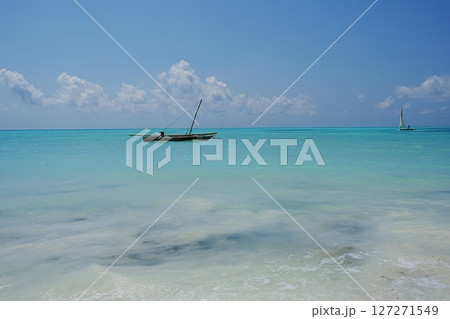 Fishing boat seen from Jambiani beach at Indian Ocean in African Zanzibar island in Tanzania 127271549