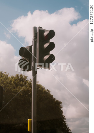 Traffic lights on M1 road, with a blue sky and cloud in the background. 127275126