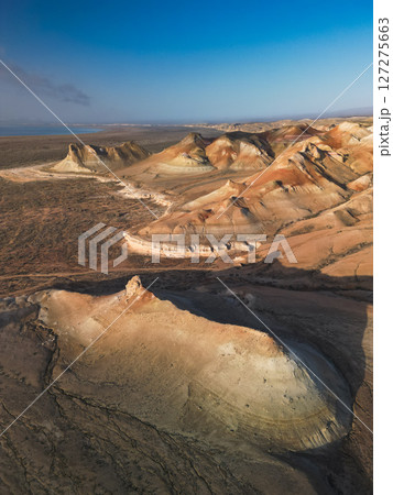 Aerial view over Aktumsik Cape's peaks near the vanished Aral Sea shoreline Aerial view over Aktumsik Cape's peaks near the vanished Aral Sea shoreline 127275663