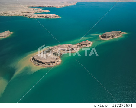 Long island and clear blue waters of reservoir seen from above in Uzbekistan Long island and clear blue waters of reservoir seen from above in Uzbekistan 127275671