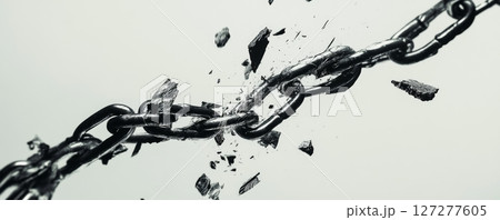 Breaking metal chain with dramatic shattering, symbol of freedom and strength 127277605