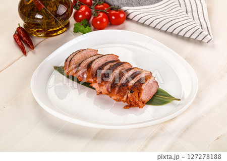 Sliced duck breast baked with cherry 127278188