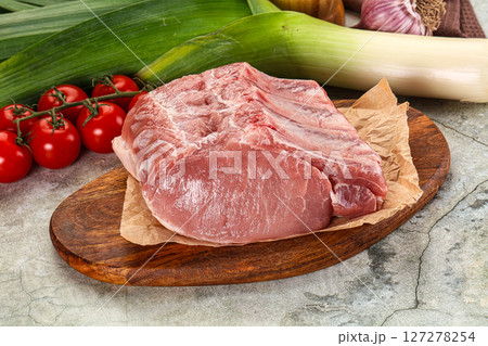 Raw pork loin cut with bone 127278254
