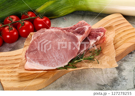 Raw pork steak loin with bone 127278255