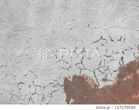 A wall with a lot of cracks and holes A wall with a lot of cracks and holes 127279088