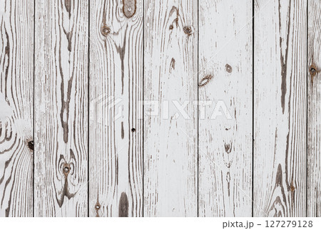 A white wooden board with many holes in it A white wooden board with many holes in it 127279128