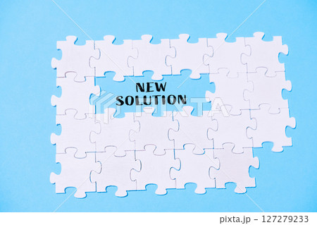 Puzzle with the word new solution written in the middle Puzzle with the word new solution written in the middle 127279233