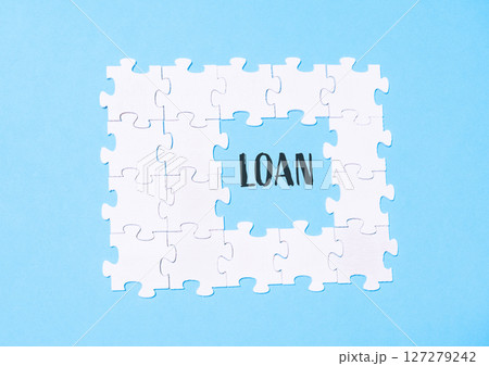 Jigsaw puzzle with the word loan written in the middle 127279242