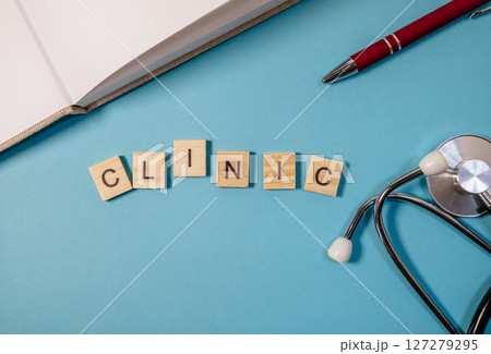A blue background with a pen and a stethoscope 127279295