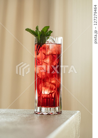 Highball glass of fresh red cocktail with mint Highball glass of fresh red cocktail with mint 127279464
